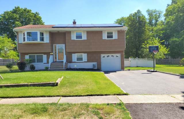 Single family, bi-level home with 4-bedrooms (one bedroom on ground level), 2.5 bathrooms, attached garage, "bonus room"  utility room located on a dead-end road! photos photos