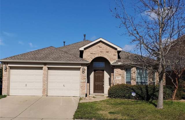This beautiful 3 bedroom 2 bathroom home is located in the sought after Woodcreek subdivision in Fate. - 313 Magnolia Drive, Fate, TX 75087
