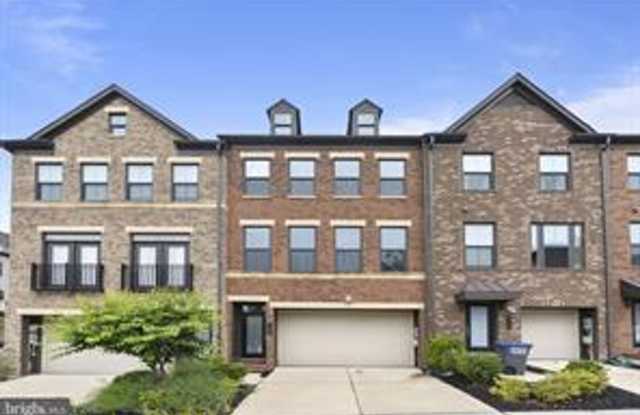 Welcome to 3156 Goldenwave Ct — a beautifully appointed 4-bedroom, 3.5-bath townhome that perfectly blends modern style, comfort, and functionality. photos photos