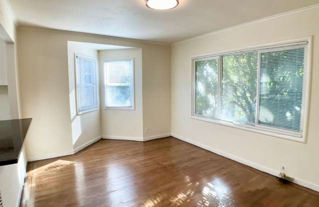 RENOVATED Top Floor. DISHWASHER! ON-SITE LAUNDRY! HARDWOOD! photos photos