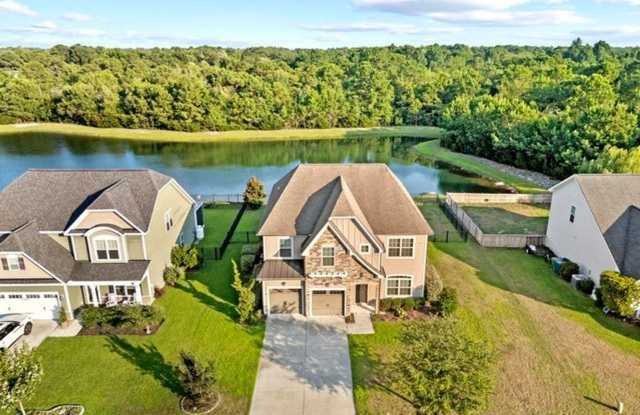 Set along a peaceful pond in the gated community of Mimosa Bay Gallery 4