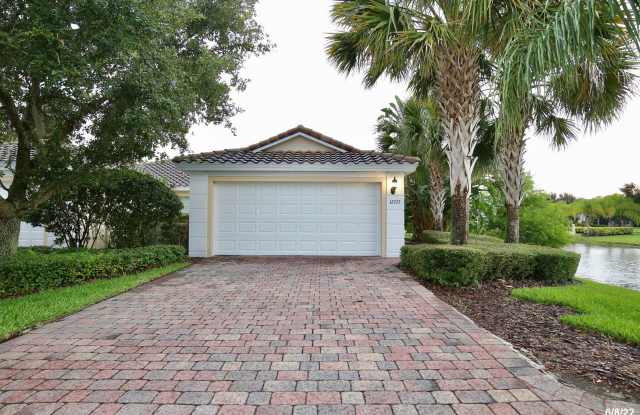 Beautiful 3/2 Corner Duplex with Water View in Highly Sought After Gated Community of Village Walk - Lake Nona! photos photos