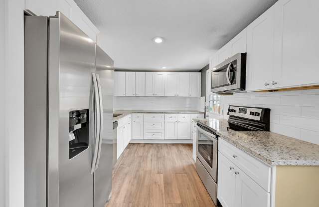 Updated 4-Bedroom Westminster Home with Fenced Yard, Solar Panels & Garage Gallery 3