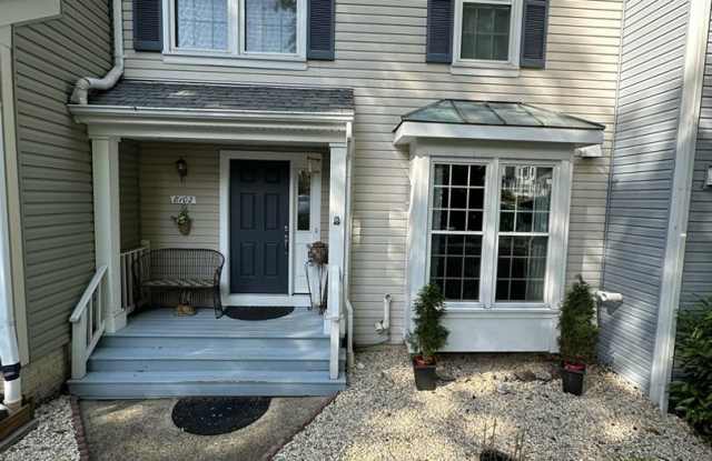 City living with country views! This 3-bedroom, 2 full and 2 half-bath townhouse in Springfield, VA, offers the best of both worlds. - 8102 Clifforest Drive, Newington Forest, VA 22153