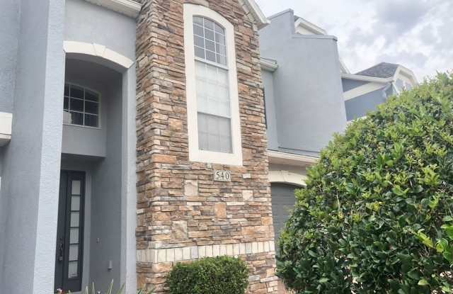 Move in NOW!WATER VIEW!! Stunning 4 bedroom + Loft, 2.5 bath Townhome Gated community in Avalon Park. 1 car attached garage. HOA handles lawn care. Primary bedroom on 1st floor. Gallery 3