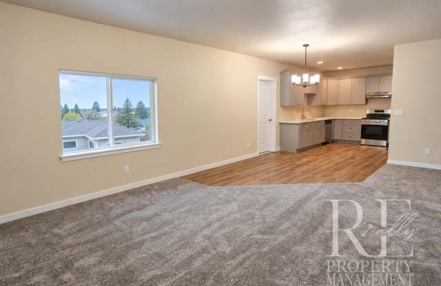 Newly Built 2-Bedroom Upper Duplex with Garage, AC & Designated Parking Gallery 3
