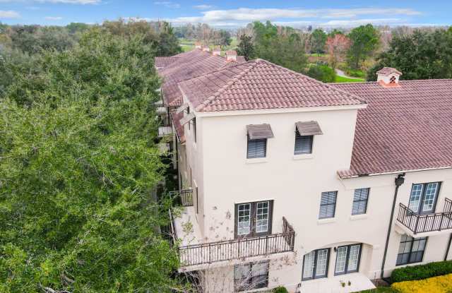 Iconic 2 story corner condo at the Terraces of Celebration. Completely renovated 2 Bedroom, 2 Bathroom with second floor Loft and wrap around balcony overlooking the Lake - 917 Waterside Lane, Celebration, FL 34747