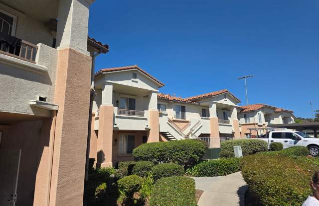 Upstairs condo in the Remington of Rancho San Diego with laundry a parking spot near all grades of school Gallery 1
