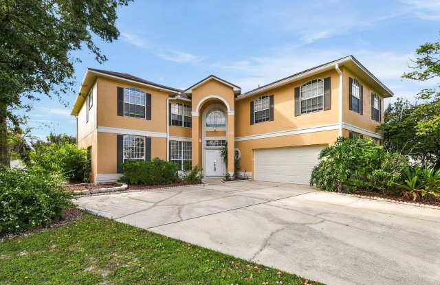 Spacious 4/4 Home in Oviedo FL!  Private Covered Pool! Convenient Location Near Shopping, Dining & SR 417! Gallery 1