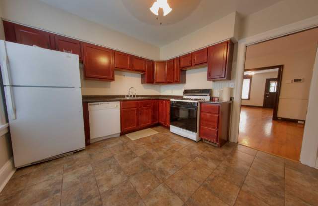This completely refinished two-bedroom, one-bathroom home features brilliant hardwood floors throughout. Gallery 1