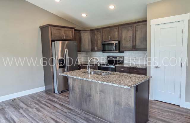 Price reduction $2,795 a month!! Spacious 4-Bedroom Clive Ranch with Finished Basement & 3-Car Garage Gallery 3