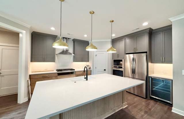 **OFFERING $1,500 MOVE-IN CREDIT & REFUNDABLE APPLICATION FEES** Newly Built Luxury 3BD, 2.5BA Downtown Raleigh Home with a Private Fenced Yard, No Shared Walls & a 2-Car Attached Garage Gallery 3