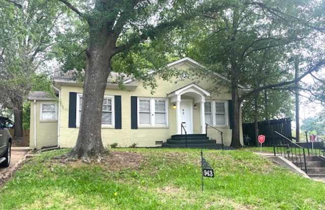This cute, but large cottage is located in the historic Belhaven neighborhood photos photos