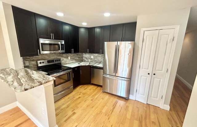 Spacious 3-Bedroom, 2-Bath Apartment with Finished Basement, Private Patio, and In-Unit Laundry Gallery 3