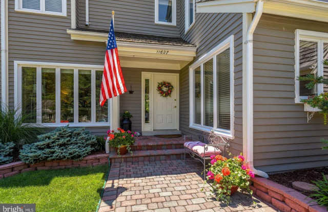 Experience elevated living in this beautifully renovated townhome nestled within the highly sought after Ashley Court Cluster in North Reston photos photos