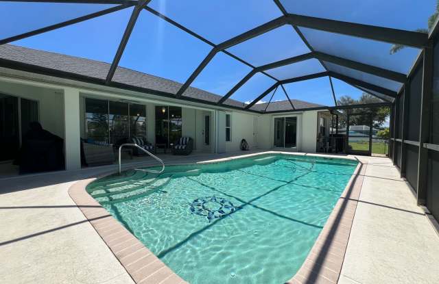 FURNISHED SHORT TERM RENTAL - 3 Bed / 2 Bath - Single Family Pool Home - $5,000/month ** Heated Swimming Pool **Canal View Gallery 3