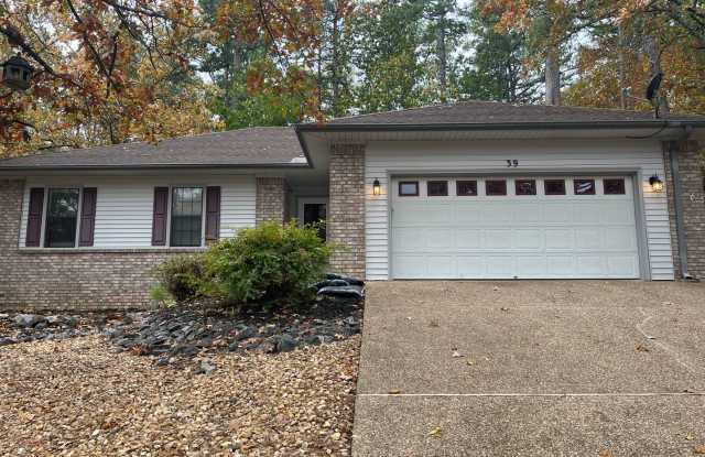 Charming 3 bedroom, 2 bath home that has been updated and is ready to be called home! This home has a 2 car garage and a level back patio area. Call 501-922-9997 to set up a showing today! - 39 Alicante Road, Hot Springs Village, AR 71909