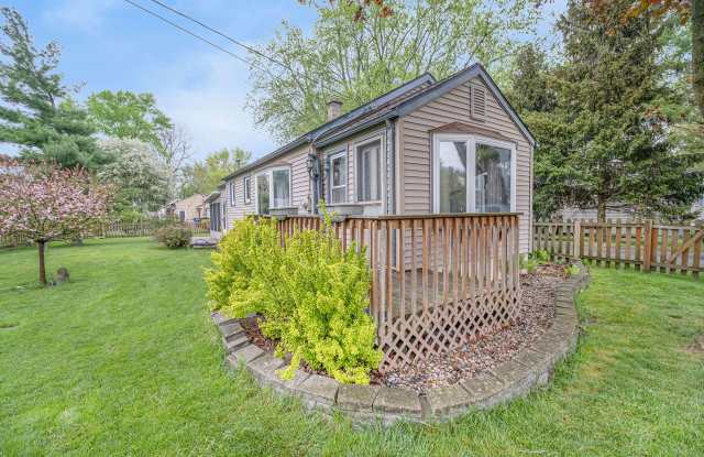 Charming, remodeled 2-Bed/1-Bath ranch style home with enclosed yard and garage with bonus storage room above photos photos