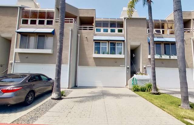 16055 Surprise Ln - **Move-In Special!!** Lovely 2 Bedroom + Den, 3 Bathroom Townhome in a Peaceful Huntington Beach Neighborhood with Harbor Views! photos photos