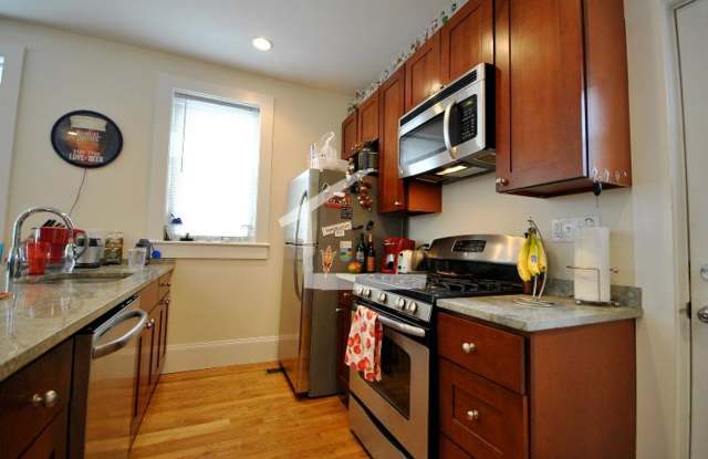 Nicely renovated Townhouse in a prime location near the Green Line with parking included! photos photos