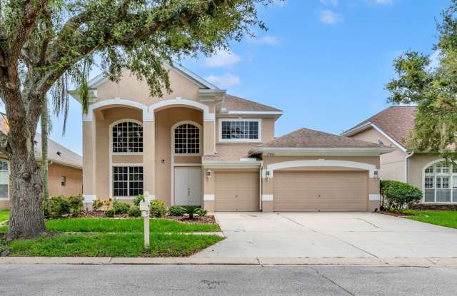 Massive 4 Bds /3.5 Bths with Loft, 3 car garage overlooking pond in Arbor Green community - 17835 Arbor Creek Drive, Tampa, FL 33647