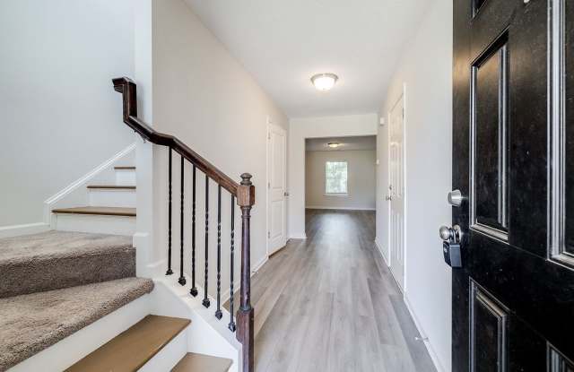 Charming 3BR Townhome with Convenient Main-Level Primary Suite Gallery 4