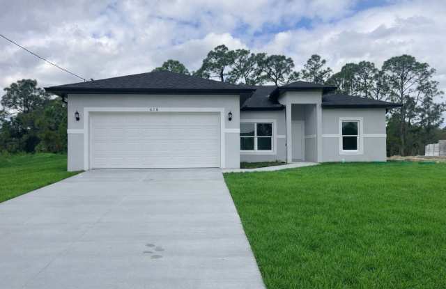 JUST BUILT! Move-In Ready 4 Bed / 2 Bath / 2 Car Garage in Lehigh Acres photos photos