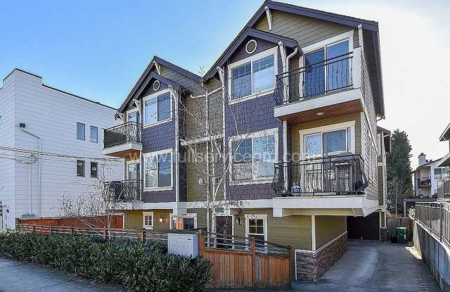 Spacious townhome with private backyard, garage parking, multiple decks, and a dedicated home office. photos photos