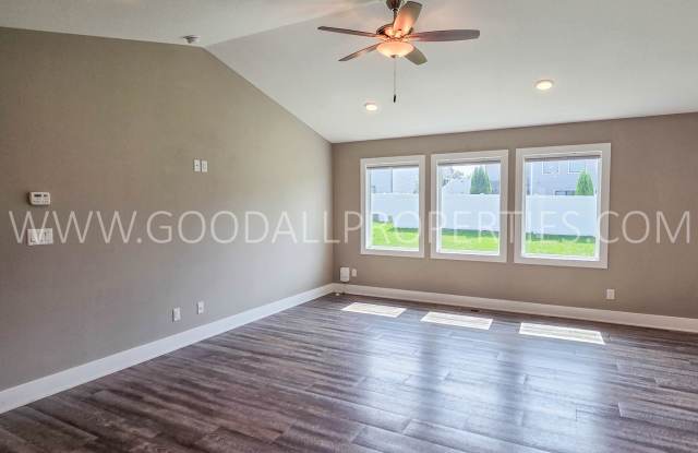 Price reduction $2,725 a month!! Spacious 4-Bedroom Clive Ranch with Finished Basement & 3-Car Garage Gallery 3