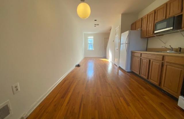 PRICE REDUCTION! A charming two bedroom one and one half  bath row house located just off New Jersey Ave in the Shaw Neighborhood! Gallery 4