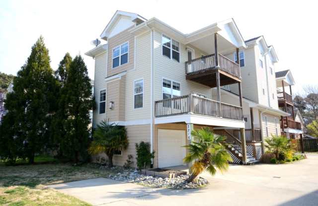 Beautiful 3-story home featuring 3 bedrooms and stylish custom finishes throughout - close to beaches & Norfolk bases! Gallery 1