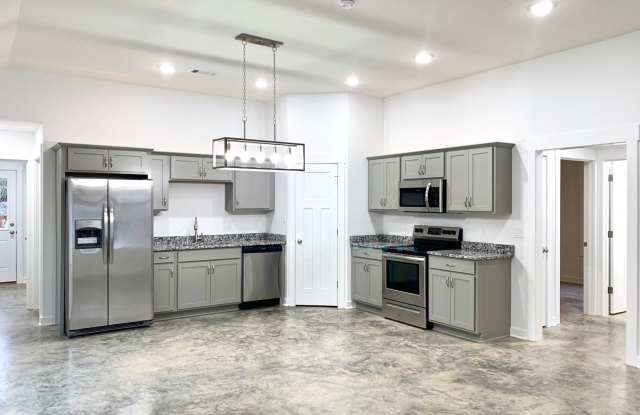 3 Bed, 2 Bath with Fenced Yard, Two-Car Carport, and Lawn Care Included Gallery 4