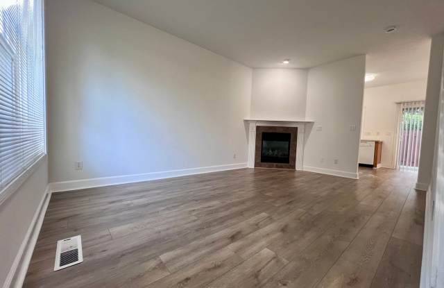 MOVE-IN SPECIAL – 1/2 Off First Month’s Rent! Charming 3-Bedroom End-Unit Townhome with Attached Garage & Private Yard! Gallery 2