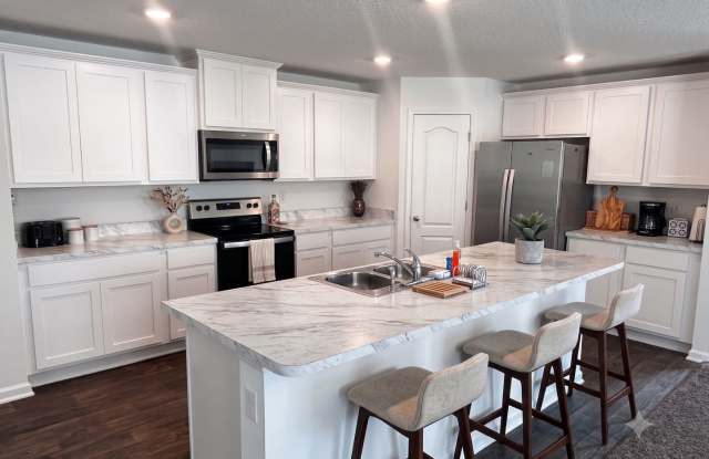 Picturesque Waterfront 4-Bedroom Home with Premium Amenities + 3 Car Garage! $500 Off First Month's Rent! photos photos