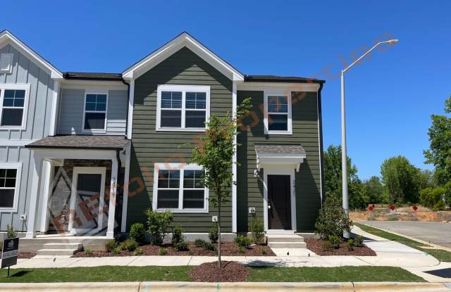 Beautiful 3 Bedroom End Unit Townhome with 2-Car Garage and Loft located in the desirable Royal Creek community in Raleigh! Available on July 05! photos photos