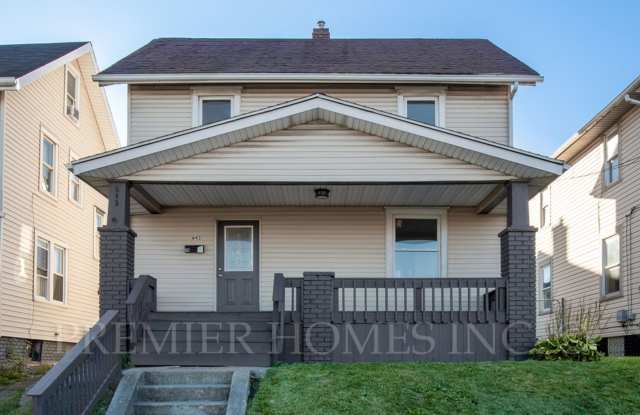 Classic 2-Story with Covered Front Porch, Original Hardwoods, Fenced Yard & Full Basement! -643 Forest Avenue SW, Canton Gallery 1