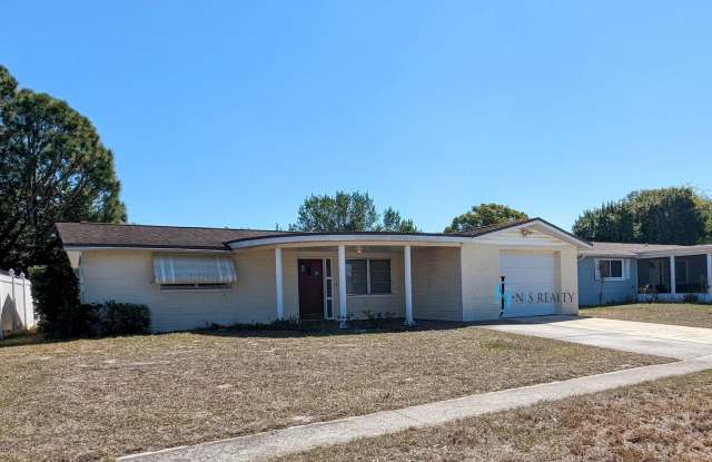 Gorgeous 2/1/1 1100 Sq. Ft. with HUGE kitchen/great room combo, tile floors throughout, BONUS ROOM  a fenced in yard!!!! - 4810 Durney Street, Elfers, FL 34652