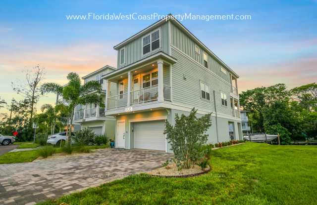 STUNNING FURNISHED CANAL HOME MOMENTS to ANNA MARIA ISLAND! LONG TERM LEASE! TRUE FLORIDA COASTAL RETREAT! Gallery 1