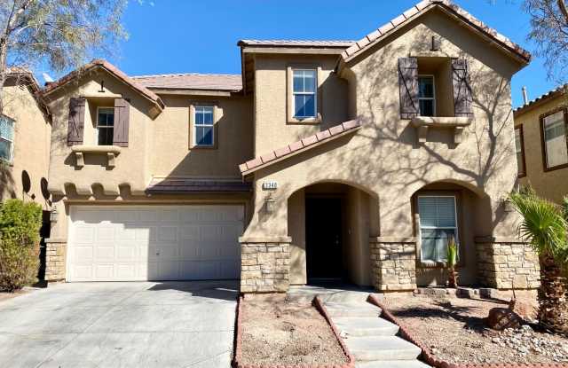 2 story home located in the community of Villas at Desert Breeze! 4 bedrooms 3 total bath located on Durango and Desert Inn. Hardwood flooring downstairs, easy to maintain backyard photos photos