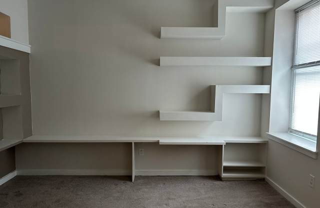 Bright Studio with lots of Built in shelving photos photos