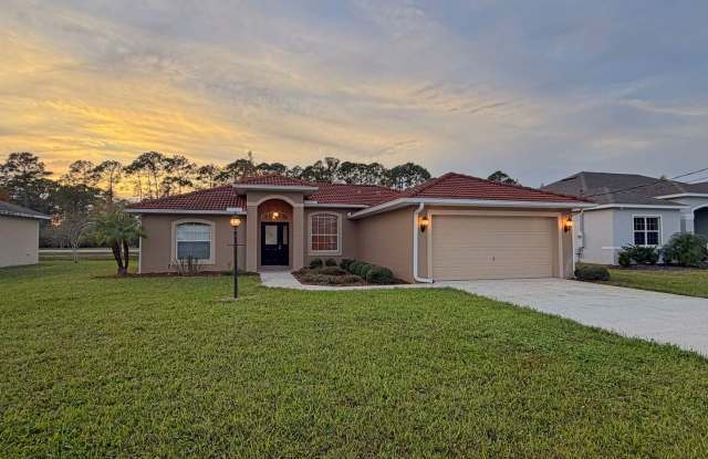 Immaculate 3-bedroom, 2-bathroom home situated on a spacious lot. - 12 Point of Woods Drive, Palm Coast, FL 32164