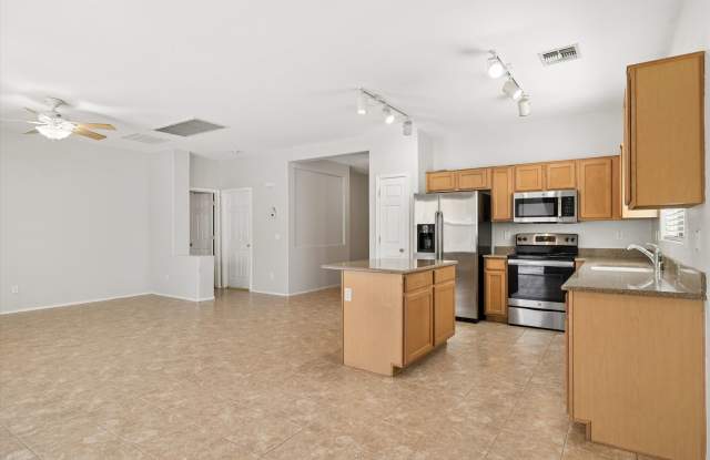 Great 3 bedroom split floor plan in Rogers Ranch, 2 car garage, Tile except in Bedrooms!!!  All appliances with pantry, Island and good storage!!!  Available NOW!!! Gallery 1