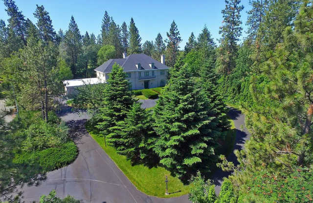 "Experience Luxury Living: Expansive 4-Bedroom Retreat Estate with Scenic Views and Elegant Finishes on Spokane's South Hill with 1.5 Acres of privacy!" photos photos