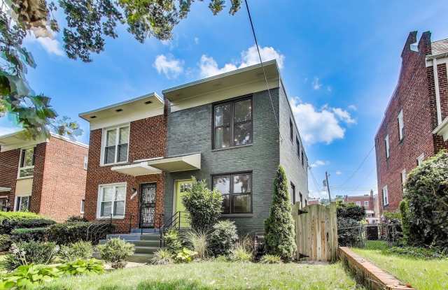 Welcome to this fully renovated, contemporary row home nestled in Michigan Park! photos photos