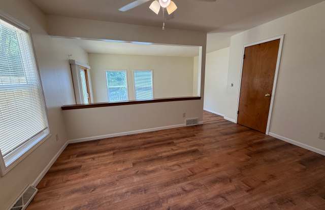 Call for rent special! New deck! 3 Bedroom, updated kitchen, updated flooring, garage, driveway, and fenced yard - 9 month lease available! Gallery 3