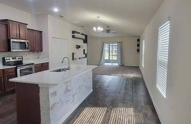 Charming 3/2 in a prime location with multiple upgrades including attache garage and screened in lanai photos photos