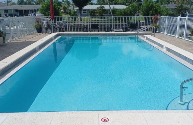 UPGRADED WATERFRONT END UNIT 3 BR / 2 BA Home With BOAT LIFT/ DOCK & OUTSTANDING VIEWS photos photos