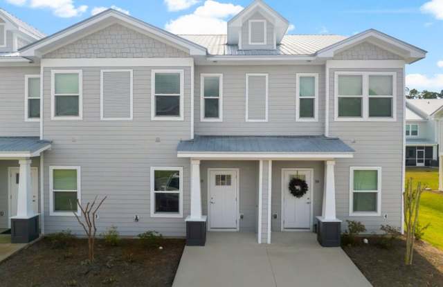 Affordable Coastal Living with Peaceful Wooded Views! Gallery 1