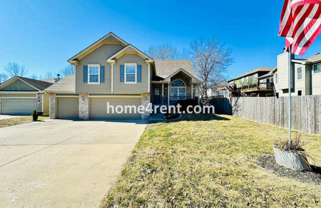 Spacious Four Bedroom Northland Home with a Finished Basement, 3 car garage and Fenced Yard! photos photos