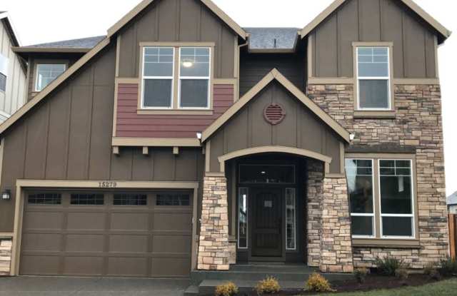 Stylish 5-Bedroom Home with Modern Kitchen, Stone Fireplace  Luxurious Primary Suite photos photos